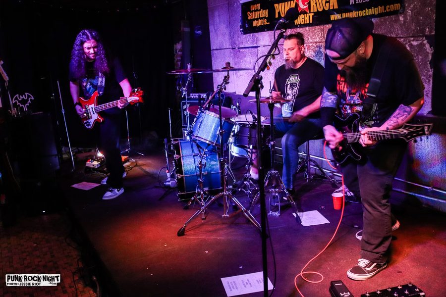 Pretty With The Lights Out playing as a three-piece at the Melody Inn under a Punk Rock Night banner